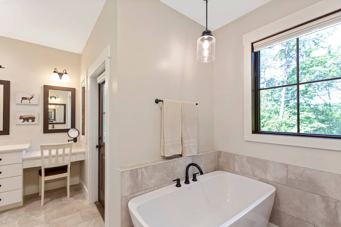 The primary bath's soaking tub and double vanity