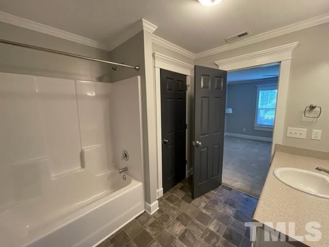 The primary bath's tub and shower