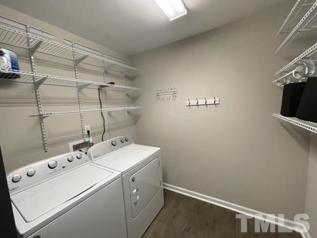 The laundry room with washer, dryer, and shelving