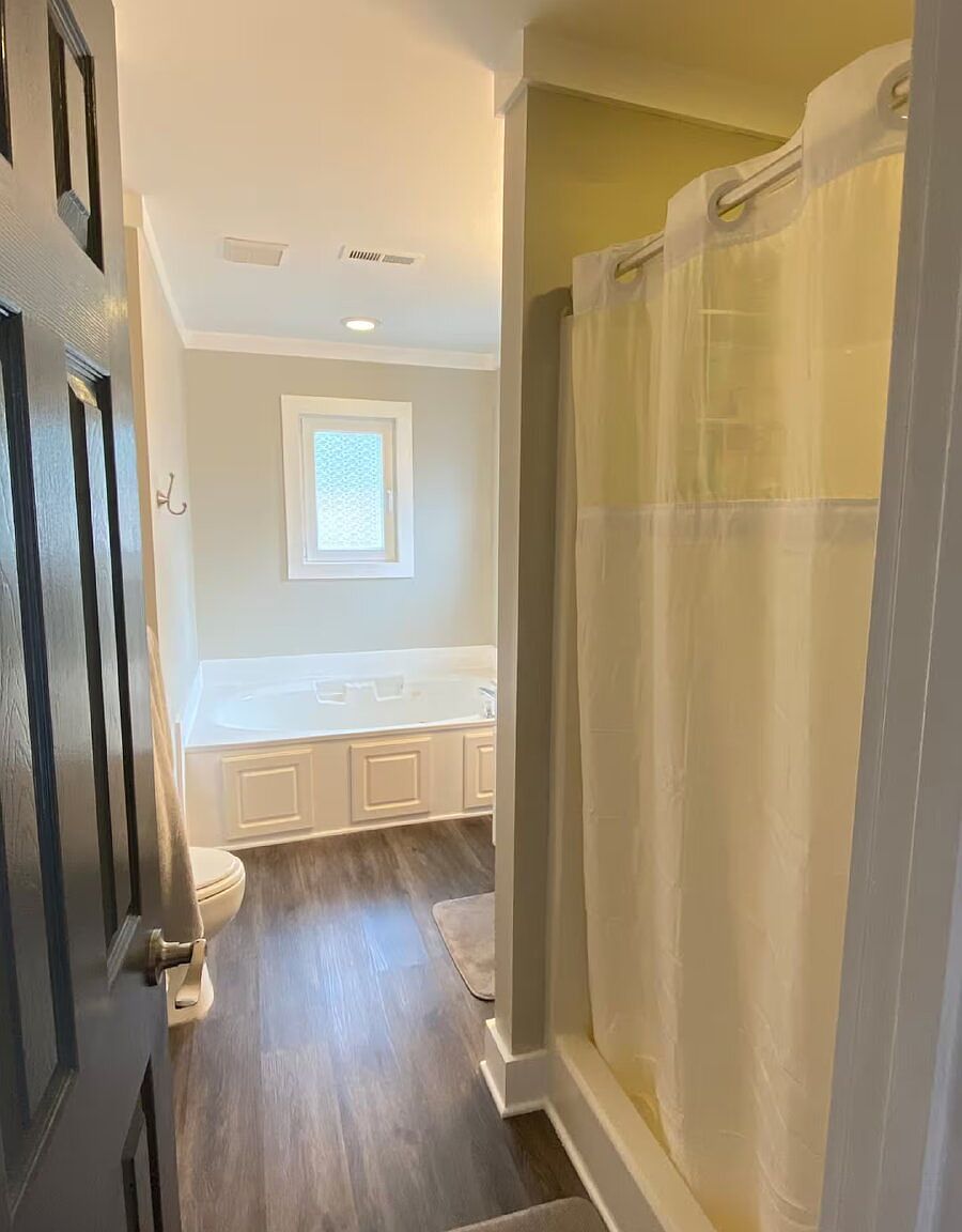 The main bath's soaking tub and walk-in shower