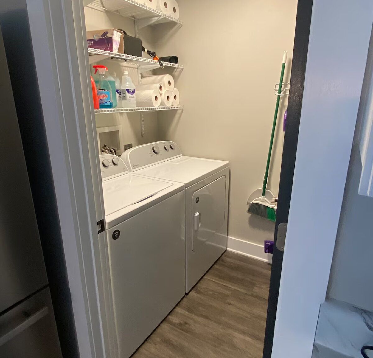 The laundry closet with full-size washer and dryer