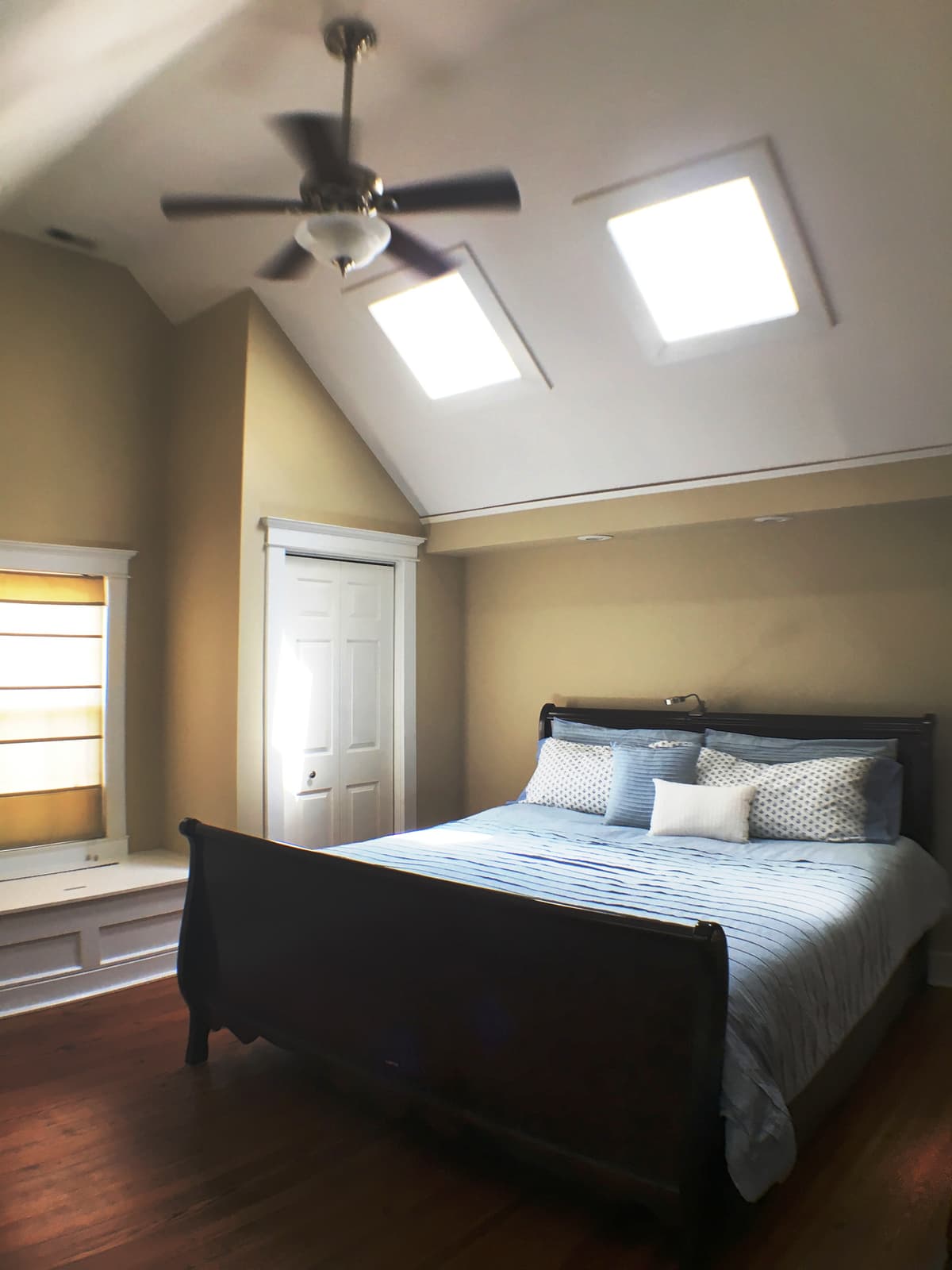 A second vaulted bedroom with skylights and the window-seat nook