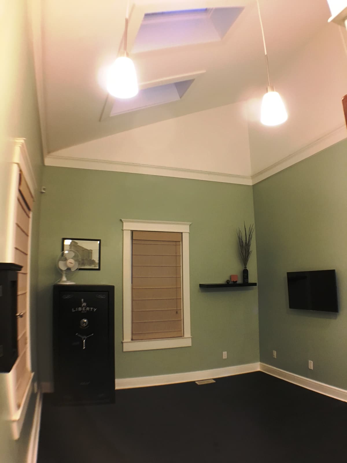 The bonus room's wall-mounted TV and big window