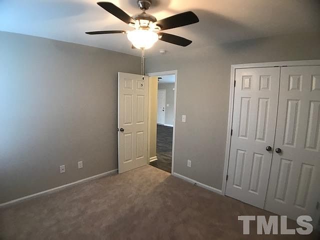 A bedroom with double-door closet